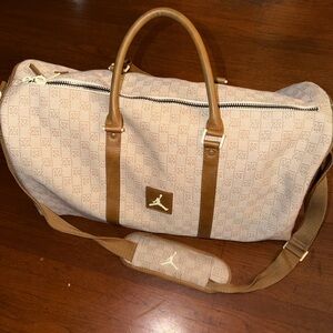 Jordan Tan and Brown Duffel Bag